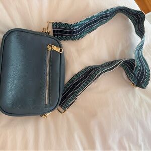 Stylish Blue Crossbody Bag with Patterned Strap